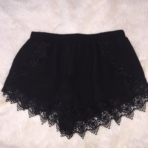 Black shorts with crochet detailing